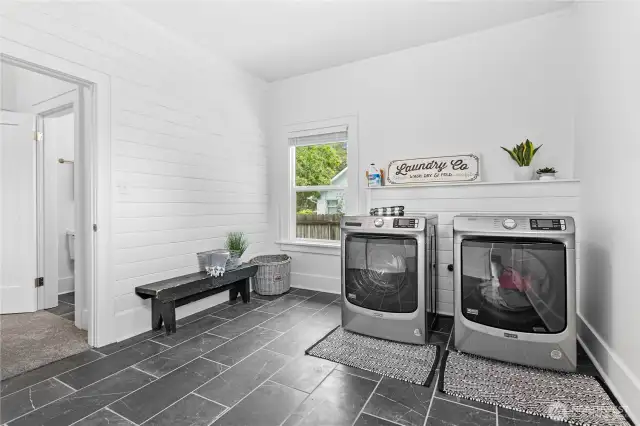 There is a very spacious laundry room with new washer and dryer.