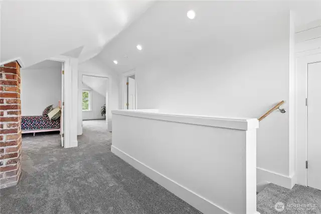 This is the upstairs landing.  There is a large storage space behind the partially seen door on the far-right hand side of this picture.