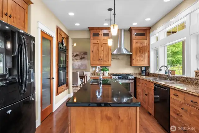 Gourmet kitchen designed to allow 4 cooks to prepare meals together. Pro style gas range with 3 speed hood fan that can handle high-heat cooking.