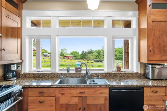 Ample counter space for prep and staging.  To the ceiling cupboards offer abundant storage to complete the space.