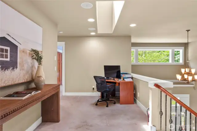 Designed with space for another desk at the top of stairs.