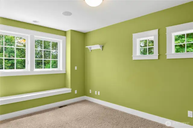 3rd bedroom with window seat and plenty of windows