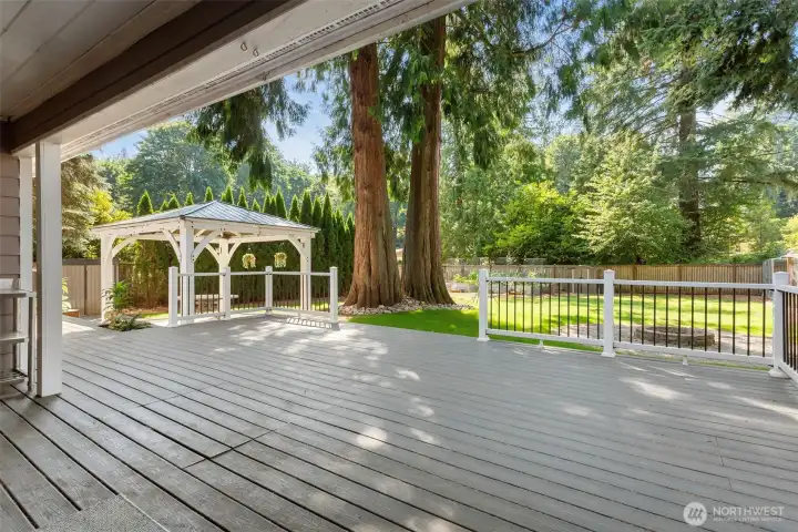 To the immediate left is a stainless steel sink and counter installed to aid in those outdoor entertaining times