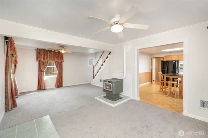Another view of the living room with cozy fireplace.