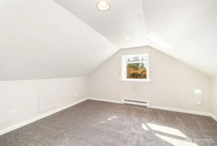 Upstairs guest bedroom #1 offers an elegant pop out window.