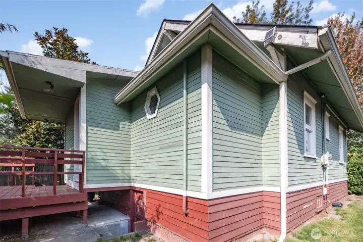 Outdoors, enjoy a partially fenced backyard with a shed and lush established landscaping.