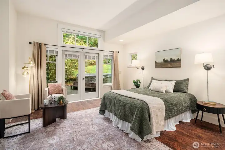 The spacious main level primary bedroom hosts a 3/4 bath, walk in closet, additional closet, and opens to a private patio for quick access to the hot tub and outdoor shower.