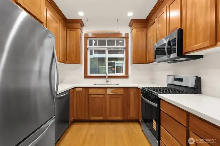 Updated kitchen with SS appliances and quartz countertops.