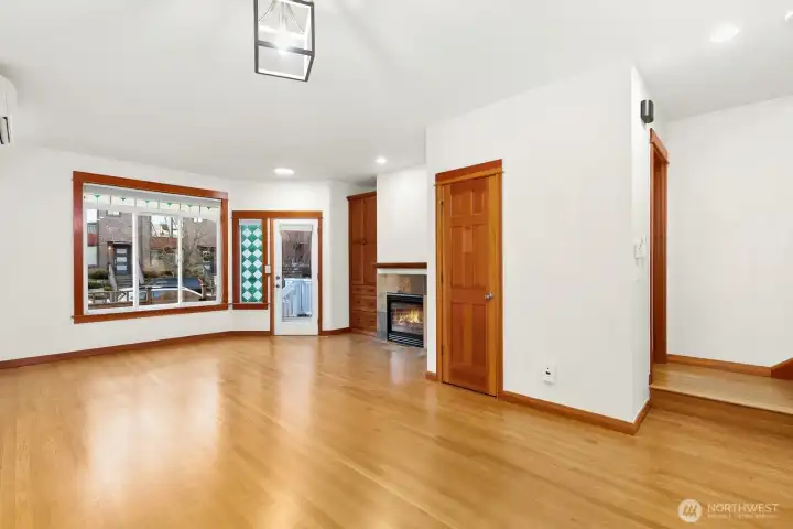 Large, open living space with gas fireplace.