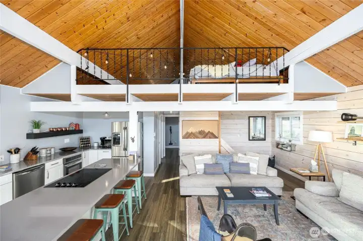 Soaring, tongue & groove ceilings, with loft upstairs
