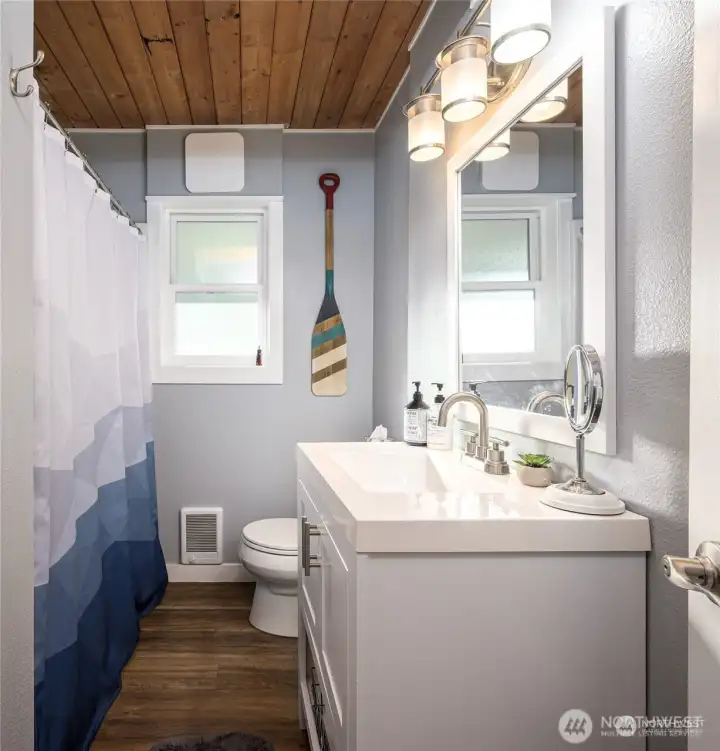 Updated bath with new tub/shower and flooring, plus updated vanity