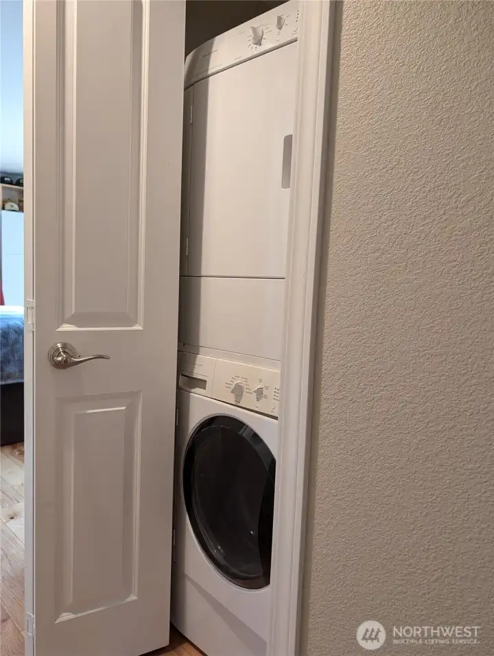 Stacking washer and dryer in hallway
