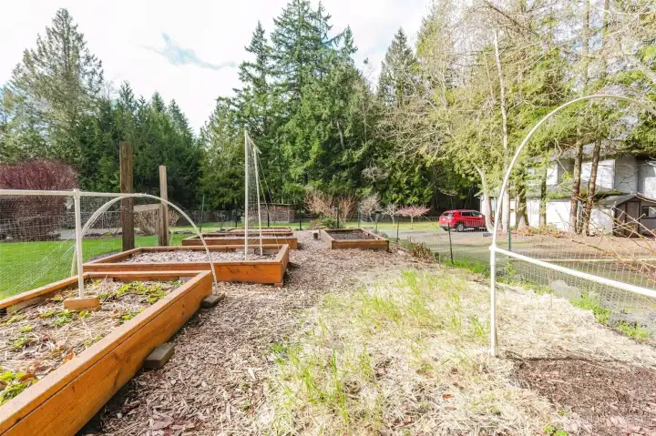 If gardening is your pleasure, this fenced in space is for you!
