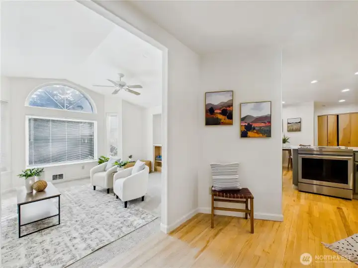 Warm entry with Oak Floors. Bright and cheerful. The kitchen is to the right of the entry.