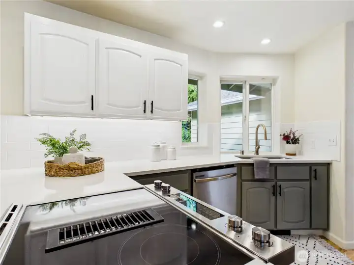 New Stove: 2025, Refrigerator: 2020, Quartz countertop: 2020 new lighting.  There is a heater near the floor below the sink to warm your feetsies while at the sink! Undercounter lighting.