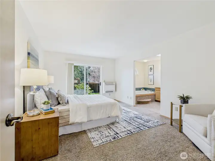Primary suite with room for a sitting area.