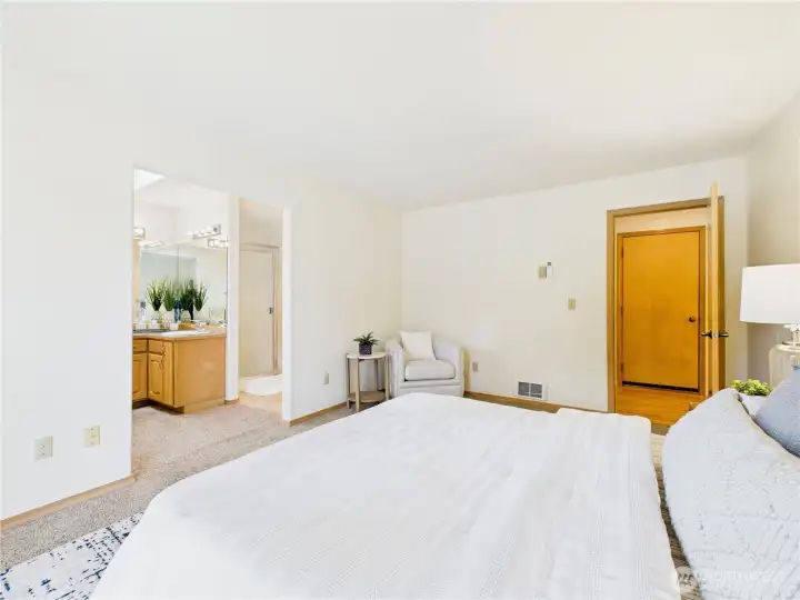 Primary suite. There is the door to the garage. The laundry is to the left of this door.