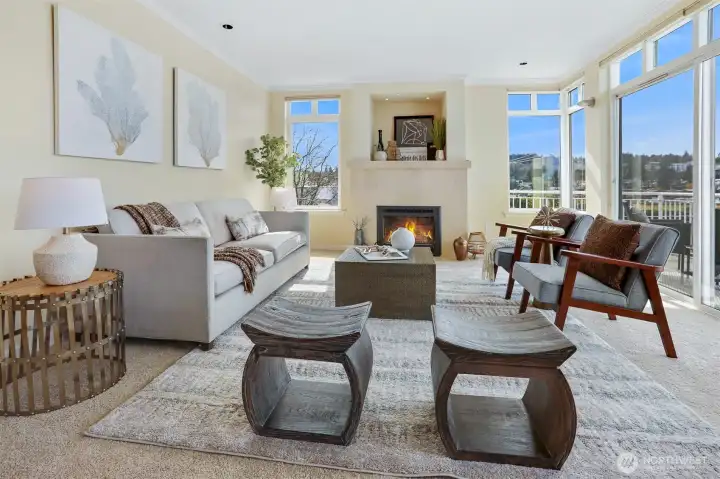 Comfortable living room has a handsome gas fireplace that is perfect for those cold winter nights.  There is also direct access to the spacious view deck.
