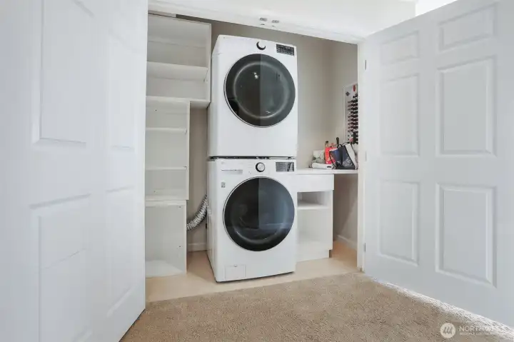 Full sized stackable washer and dryer included.  Extra storage space too!