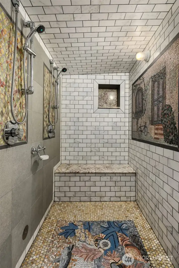 Incredible steam triple shower with intricate, artistic tile work