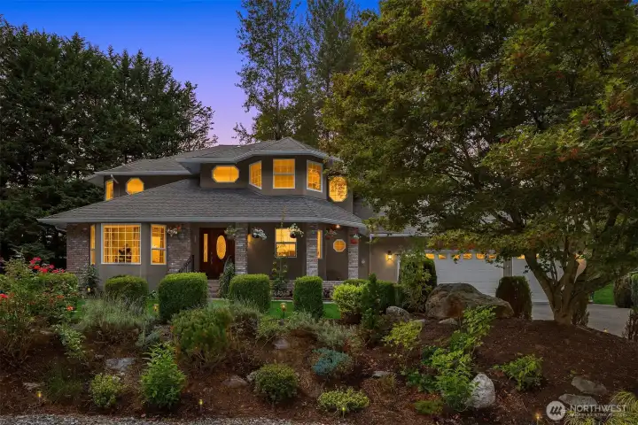 Manicured gardens and lush greenery enhance the estate-like feel of the property.