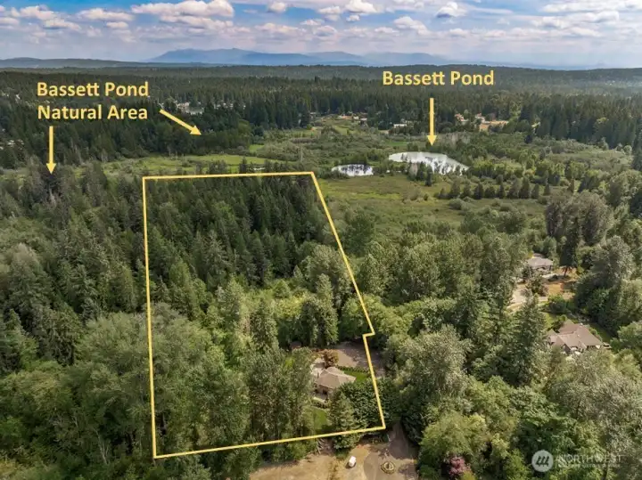 This property is adjacent to Bassett Pond Natural Area. This hidden gem, nestled in the Sammamish River Valley, provides a sanctuary for wildlife and a tranquil spot for nature enthusiasts to explore. Approximate Lot Lines.