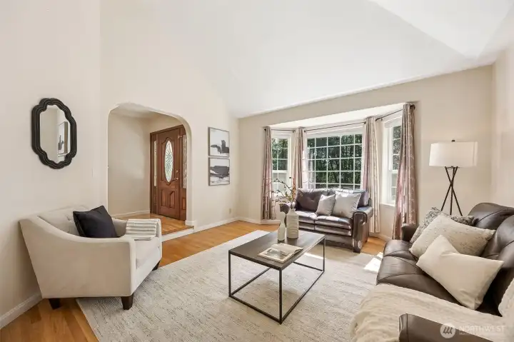 Large bay window overlooks the scenic front yard and pours natural light into the room.