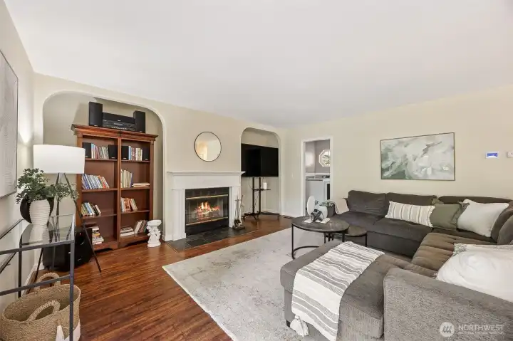 Adjacent to the kitchen is a comfortable family room with a warm and elegant fireplace banked by two media niches.