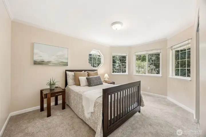 Roomy and bright bedroom three.