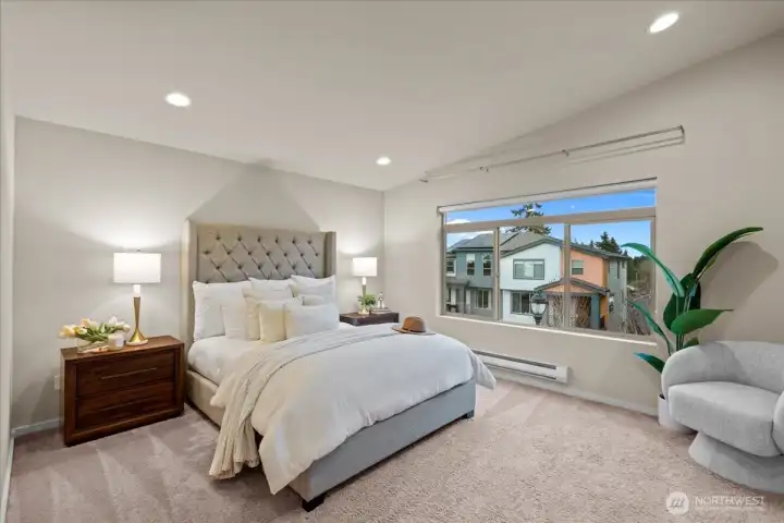 Primary Bedroom with large windows and ample natural light. Spacious layout with room for additional seating or furnishings.