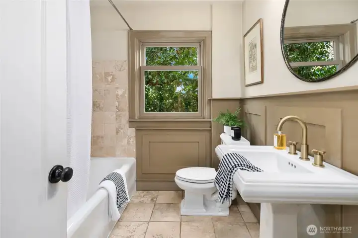 Full bath on main level.  There are two hall closets in this hallway to store linens and supplies.