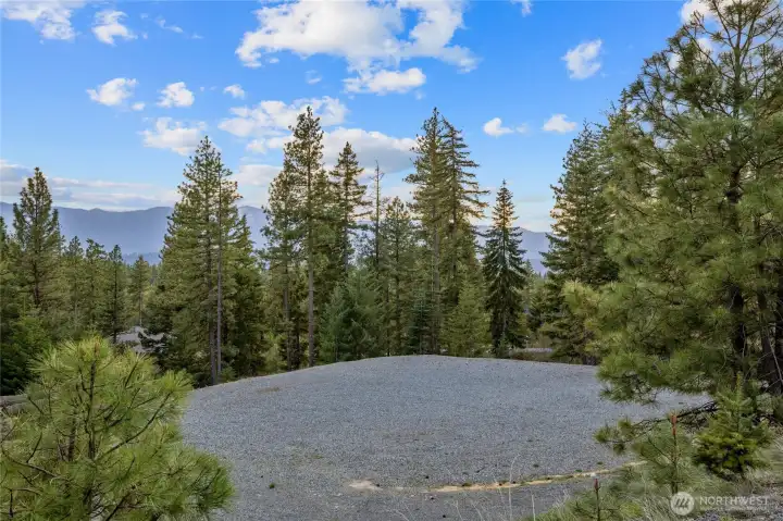 Looking Southwest on the property.  Nice level and graveled building pad ready to go.