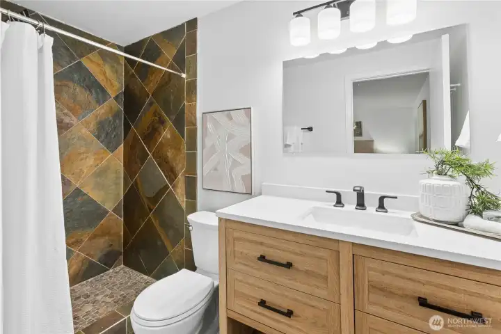 New lighting, vanity, toilet, paint, and mirror!
