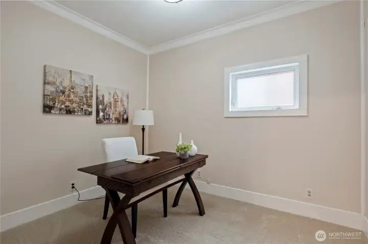 Office, bedroom, library? Right off the dining room and with fresh carpet