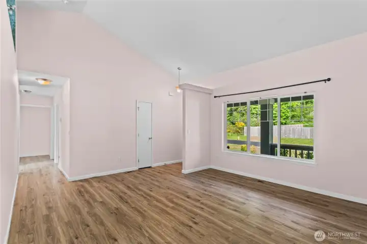 Looking back towards the front entrance and hallway leading towards 3 generous sized bedrooms.