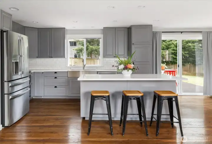 Functional & timeless kitchen open to dining and living room. Functional & timeless kitchen open to dining and living room.