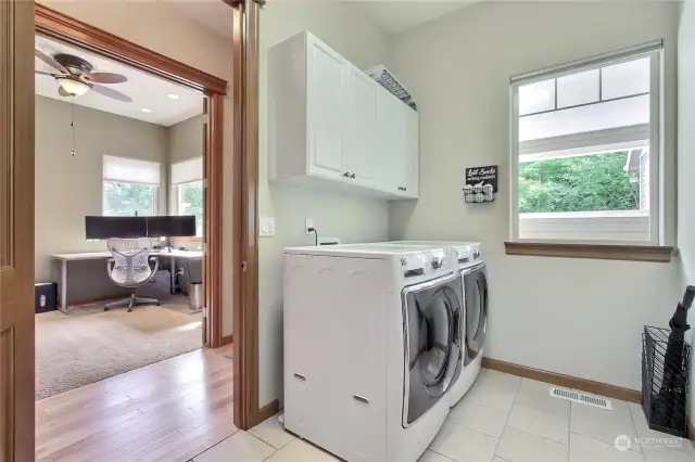 As you enter from the carport, you will find this bedrooms/den/office on your right (shown left in this photo) and your large utility room with handy cabinets and plenty of storage not shown.