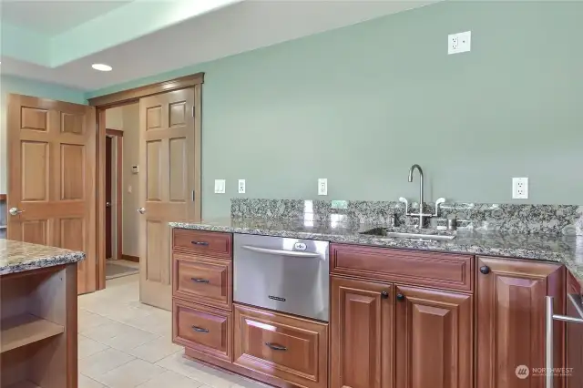 This wet bar is amazing and well-equipped! Stainless Kitchen Aide built-in dishwasher, mini freezer and wine fridge!