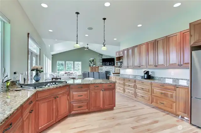 View from your kitchen to great room, cabinets and counter space for DAYS. Love the 5-burner propane cooktop as well!