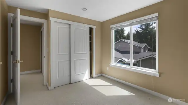 Second guest bedroom located on the second also features large window, recess lighting, and generously sized closet.