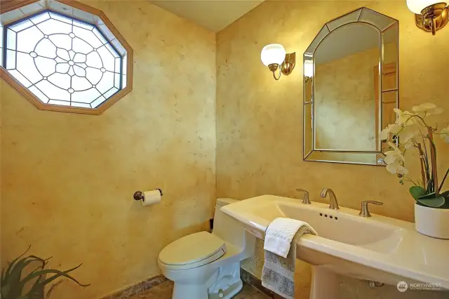 Powder room with leaded glass window.