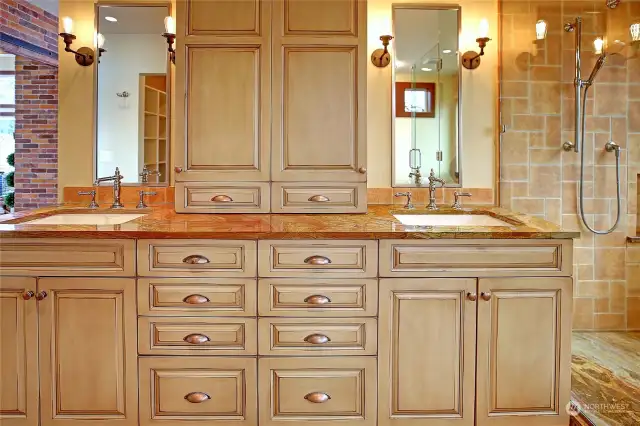 Custom dual lighted vanity with stone counter tops.