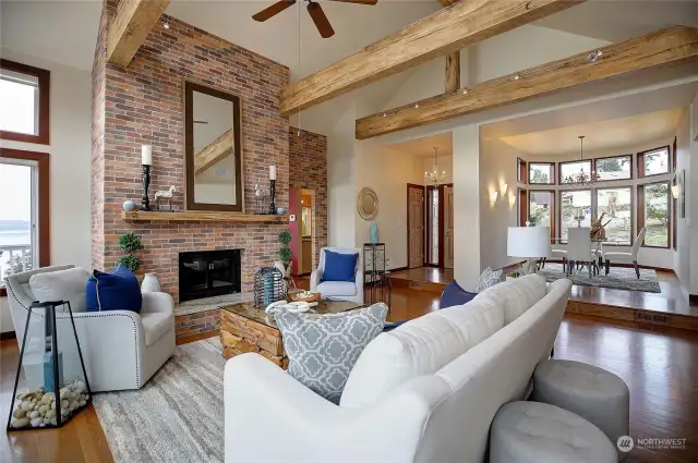 Another angle of the great room looking towards the dining room and front entry. Lots of beams certainly add a nice touch!