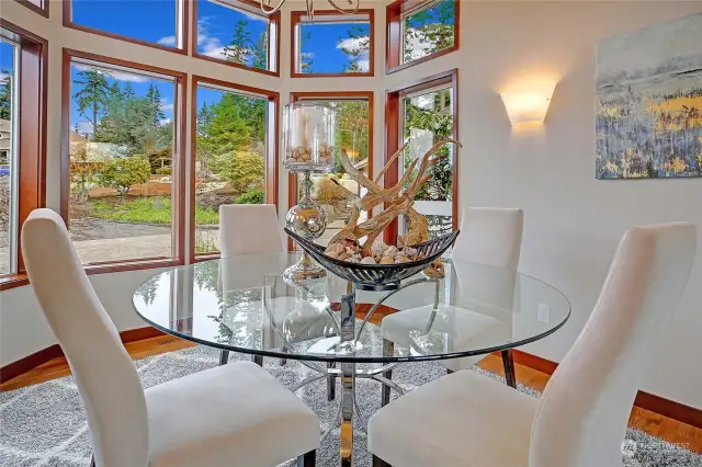 Dining room with plenty of windows all wood wrapped.