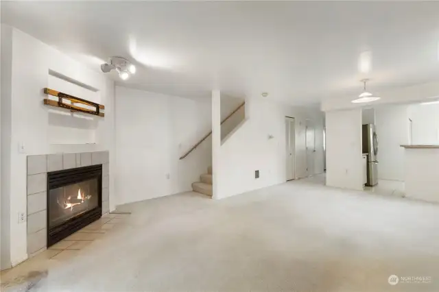 Gas fireplace & staircase to upper level