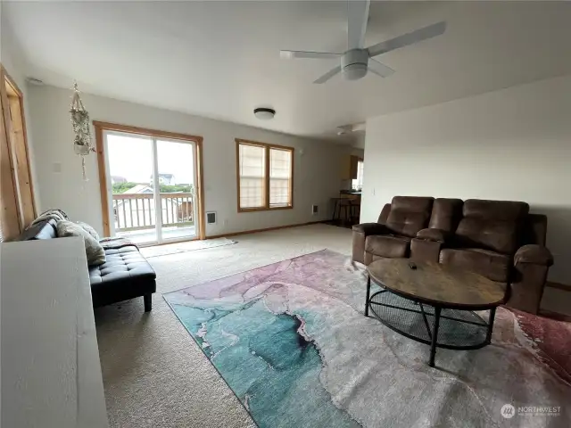 spacious living room can see sliding door to enter deck.