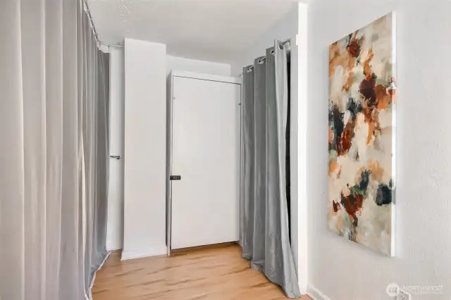 There are 2 Murphy Beds located in the condo. This is the single bed. Curtain can be drawn for privacy.