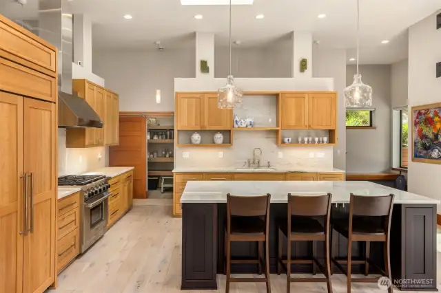 Beautifully designed kitchen with quartzite counters and backsplash.