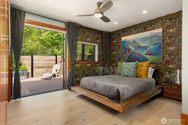 The primary suite with built-in closets opens to a private back deck.