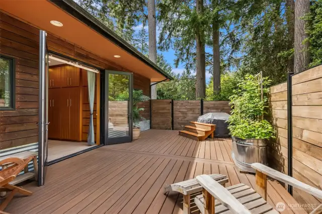 The primary suite deck includes an outdoor tub, the perfect place to soak in the stars under the night sky.